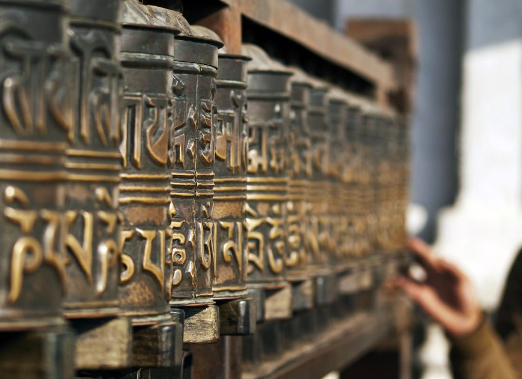 A picture of Photo of the Metal Prayer Wheels in Nepal